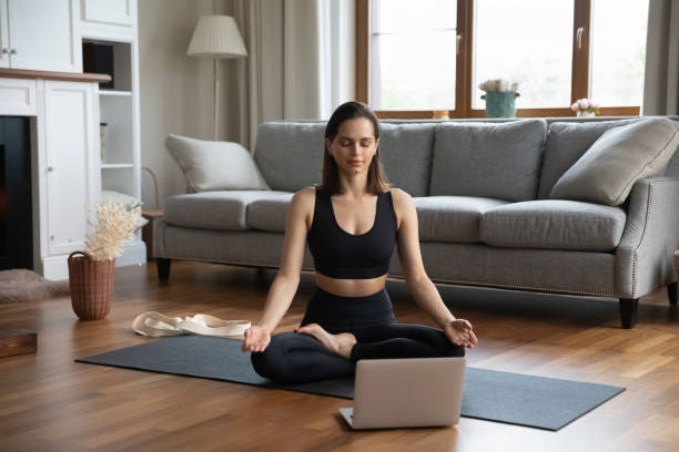 istock Calm peaceful yogi meditating in lotus pose with zen hands 1367031964