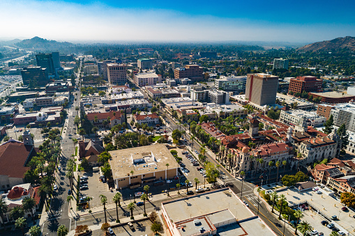 Downtown Riverside aerial skyline view with the historical Mission Inn in the foreground on the right.  Riverside is part of the Inland Empire region of the Greater Los Angeles Area.