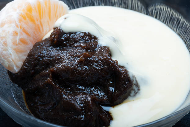 Traditional Finnish cuisine - Typically rye based Mämmi is eaten around Easter with fresh cream or custard. stock photo