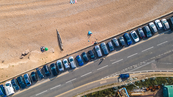 Aerial view of beach side by the road with parked cars on a side, Hove, East Sussex, UK