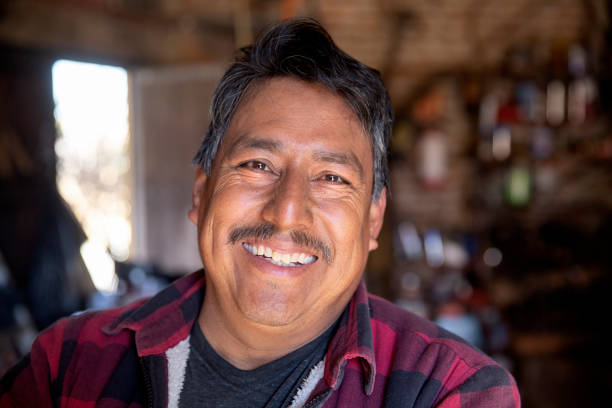A happy craftsman A smiling, friendly looking metal worker in his workshop mexican ethnicity photos stock pictures, royalty-free photos & images