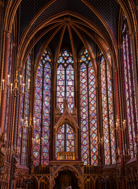 The inside of the famous Sainte Chapelle in Paris with impressing colorful windows The inside of the famous Sainte Chapelle in Paris with impressing colorful windows, France sainte chapelle stock pictures, royalty-free photos & images