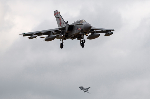 Lincolnshire, UK - July 4, 2014: Royal Air Force (RAF) Panavia Tornado GR4 ZA600 from No.41(R) Squadron on approach to land at Waddington with a Eurofighter Typhoon in the background.