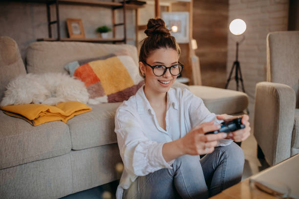 istock Woman playing video games 1367039247