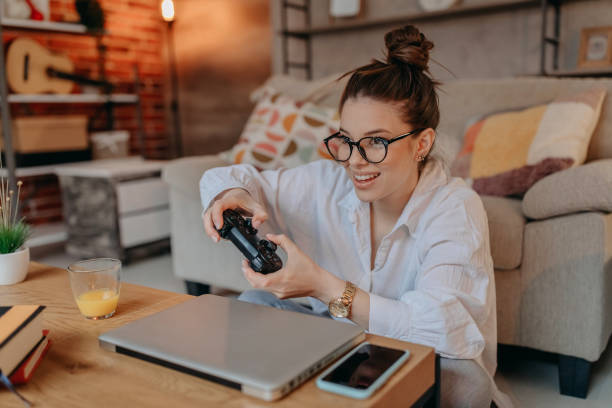 istock Woman playing video games 1367039276