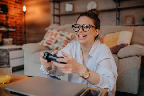 istock Woman playing video games 1367040065