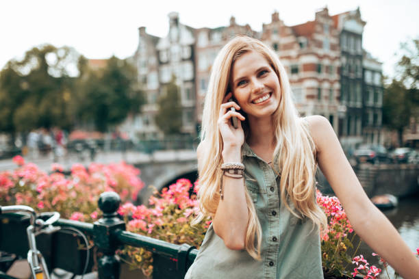 istock woman on the phone in amsterdam 1367040267