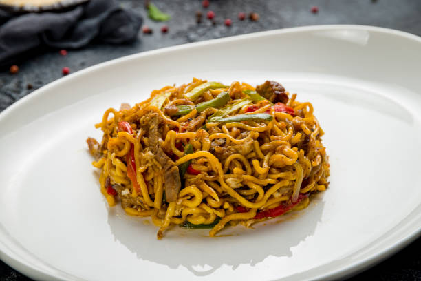 istock egg noodles with beef on dark stone table macro close up 1367040524