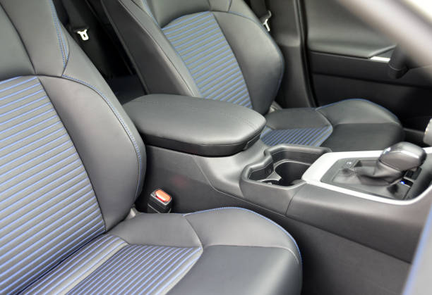istock Armrest in the luxury passenger car with cup holder between the front seats 1367042815