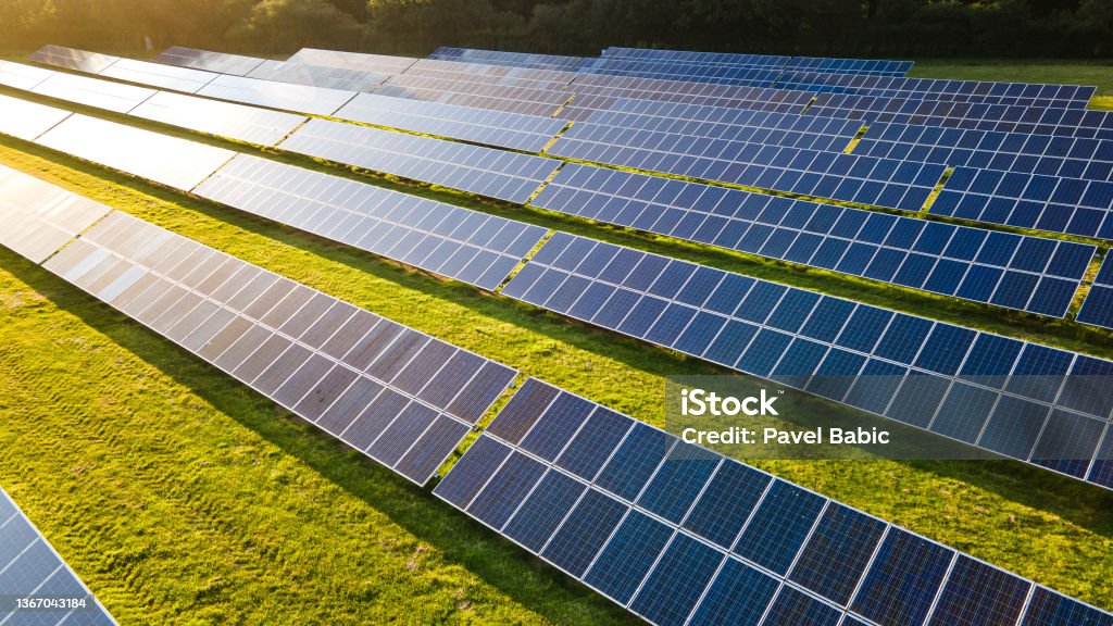 Solar power farm in the evening. Solar power farm in the evening, fields of West Sussex, UK. Solar Power Station Stock Photo