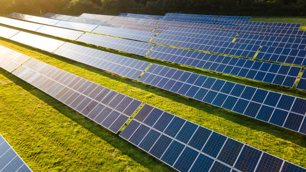 Solar power farm in the evening. Solar power farm in the evening, fields of West Sussex, UK. Solar Energy stock pictures, royalty-free photos & images