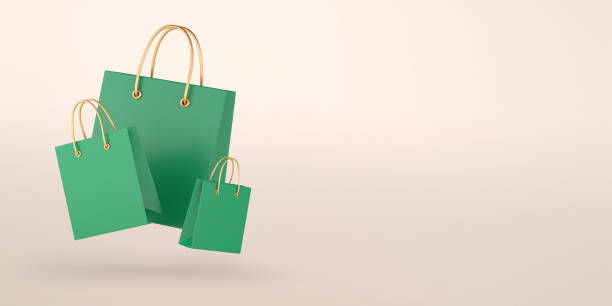 베이지 색 배경에 녹색 쇼핑 가방 - shopping shopping bag shopping mall retail 뉴스 사진 이미지