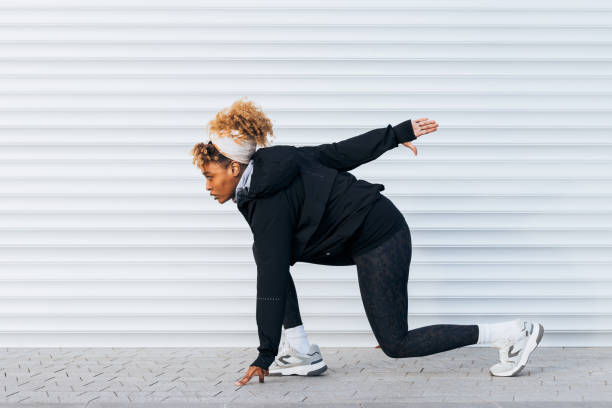 istock Beautiful Female Athlete in a Running Starting Position 1367044434