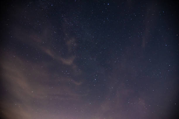 istock Dark night sky with visible stars. 1367050573