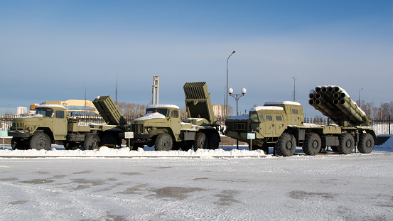 Russian weapons.Soviet Katyusha combat vehicles on a blue sky background.