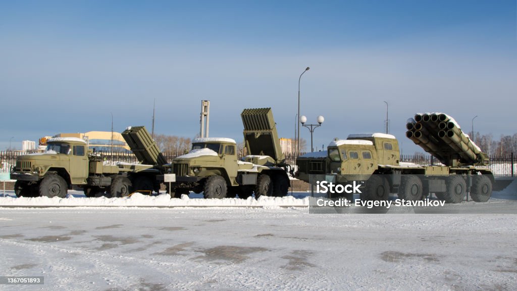 Russian weapons.Soviet Katyusha combat vehicles on a blue sky background. Russian weapons.Soviet Katyusha combat vehicles on a blue sky background Russia Stock Photo