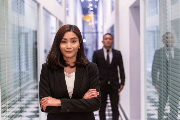 Young mixed race businesswoman smiling to camera stock photo