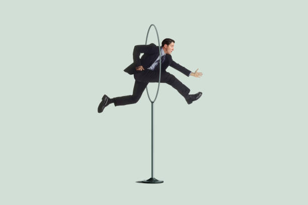 istock Businessman Jumping Through A Hoop 1367053221