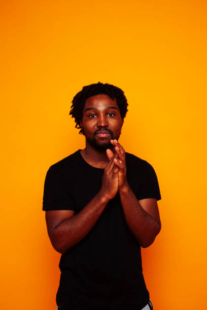 istock young handsome african american guy student posing cheerful and gesturing on yellow background, lifestyle people concept 1367055993