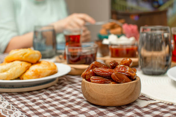 Middle Eastern traditional breakfast during Ramadan fasting (aka: Sahur or Suhoor). Date fruit for dinner or iftar.  Ramadan background. Ramadan kareem. Ramadan Suhoor aka Sahur (morning meal before fasting). Or iftar (evening meal after fasting) sesame bagel stock pictures, royalty-free photos & images