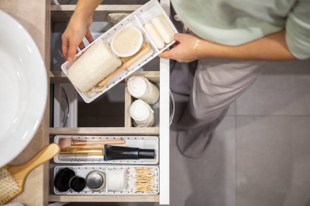 istock Top view mother hands neatly putting female kid clothes into plastic case box comfortable storage 1367058647