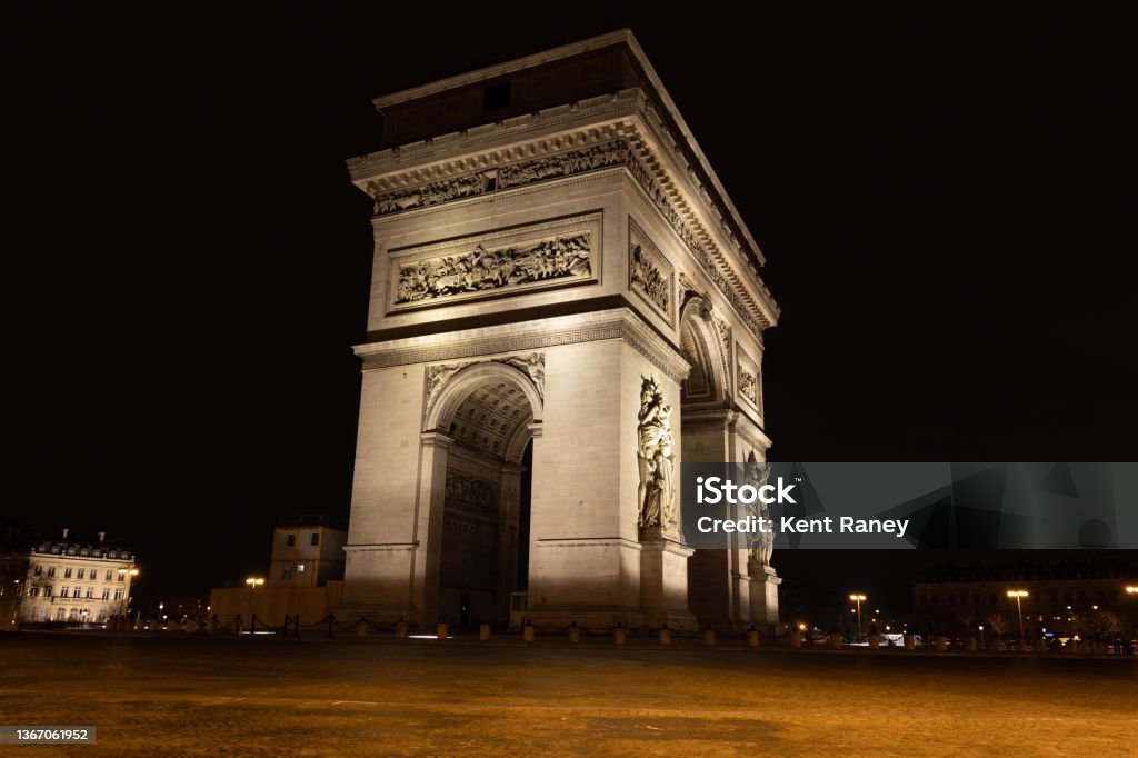 Arc De Triomphe at Night Arc De Triomphe illuminated at night, Paris, France. Night Stock Photo