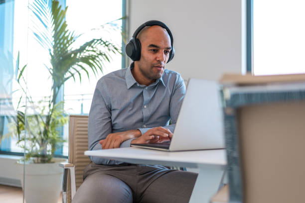 istock Mixed Race Male in 40's Online Education Video Conference 1367063209