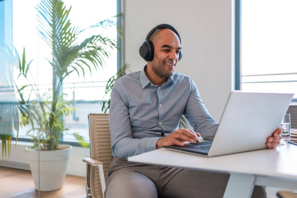 istock Smiling Mixed Race Male in 40's Online Education Conference Call 1367063214