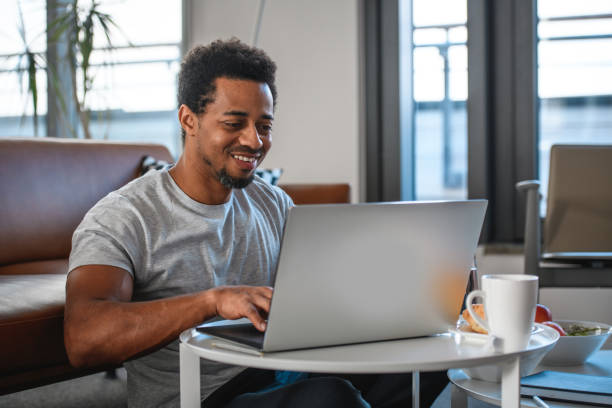 istock Smiling Mixed Race Mid Adult Enjoying an Online Course 1367063227