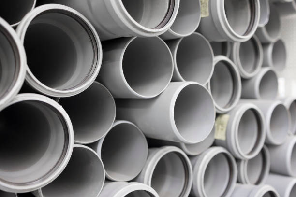 istock PVC water pipe in storage . Background of plastic pipes . Soft focus 1367063470