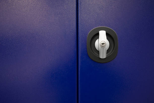 istock Close up keys lock in blue metal door 1367063487