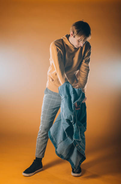 istock Athletic contemporary dancer isolated on orange wall 1367064231