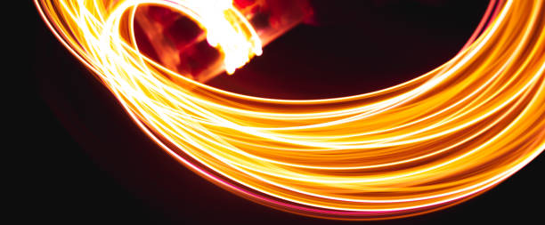 istock Abstract background freezelight comet tail from golden blurry stripes on a black 1367064925