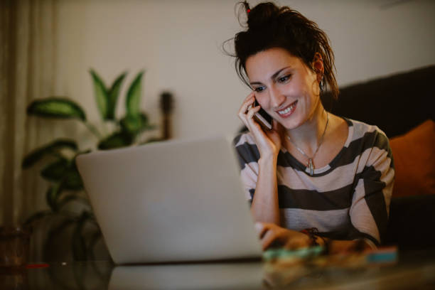 istock young woman checking her laptop at home 1367070726
