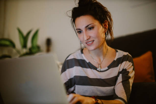 istock young woman checking her laptop at home 1367070727