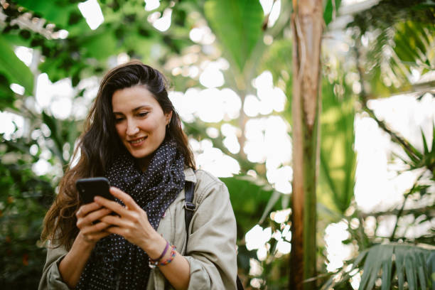 istock woman checking apps on the mobile phone 1367070837