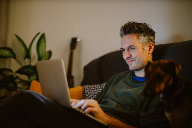 istock mid aged man working on the laptop at home 1367071525