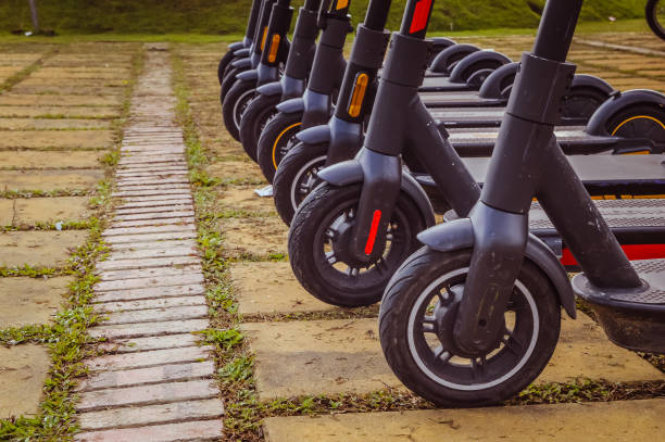 istock An electric scooter in a row at the park 1367072481