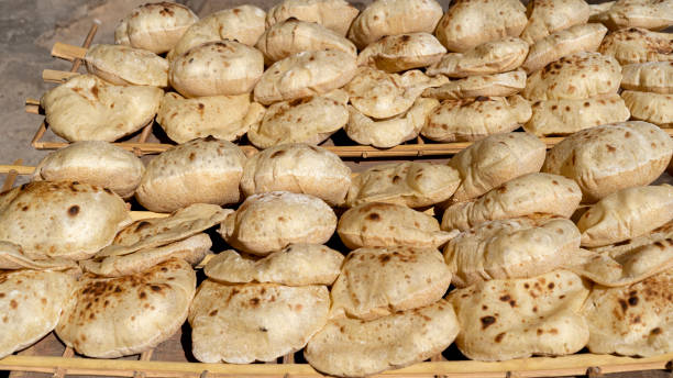 Egyptian fresh bread Aish Baladi in the street market stock photo