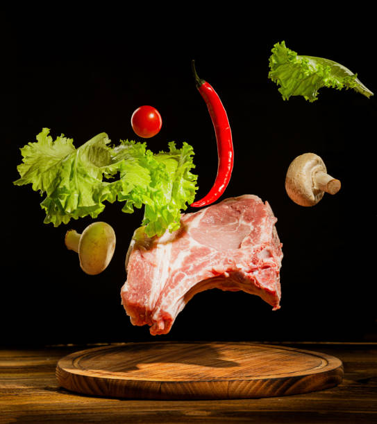 istock raw pork with salad and pepper 1367077508