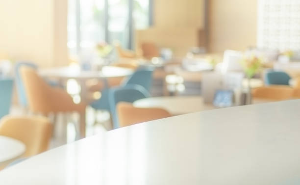 istock Space of desk over blur cafe background 1367077562