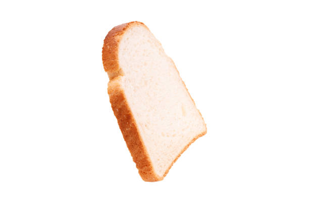 istock piece of wheat bread isolated on white background. side view 1367078390