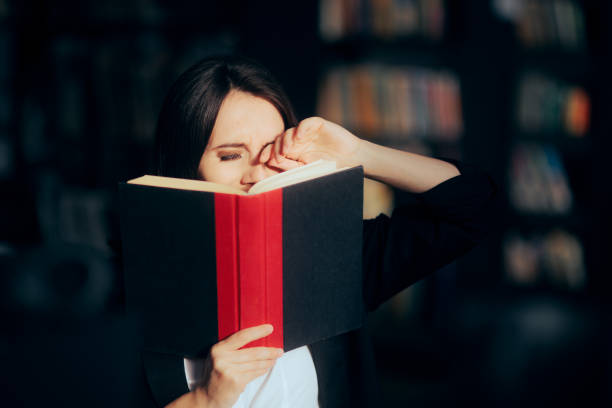 istock Tired Woman Having Sore Eyes from Reading a Book 1367080152