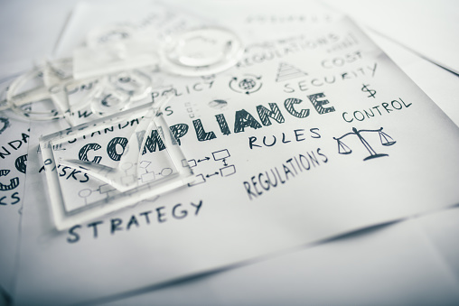 Compliance concept on white papers