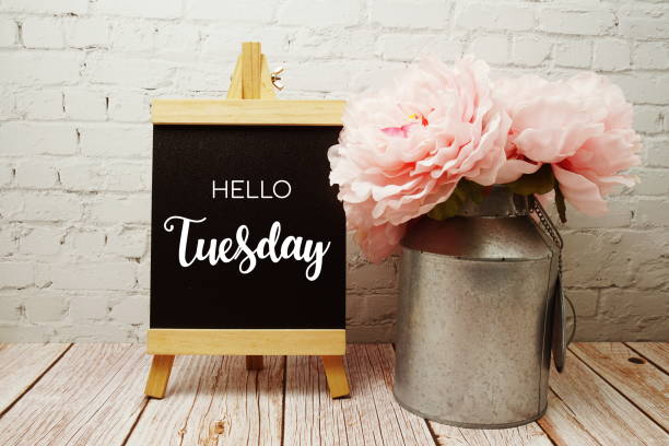 istock Hello Tuesday typography text on easel wooden board 1367083748