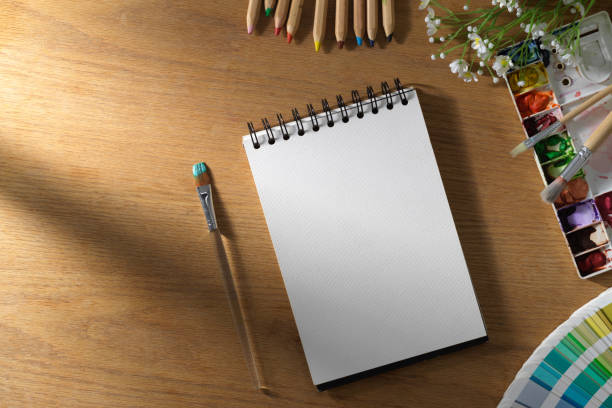 istock An empty page on spiral notepad with painting equipment 1367085460