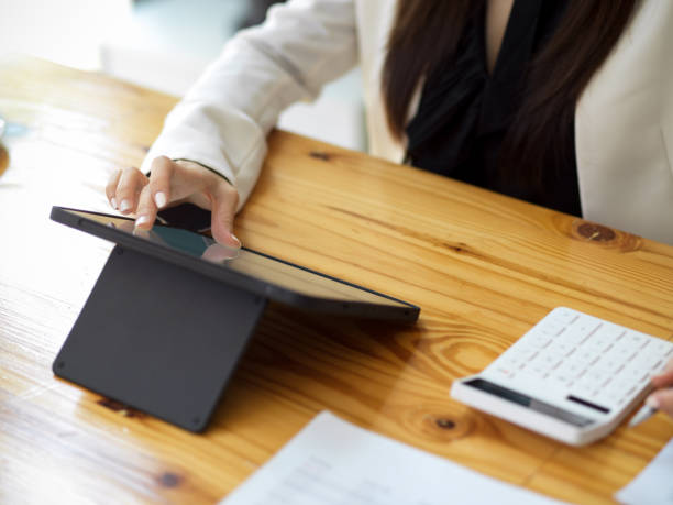 istock Cropped image of an accountant using digital tablet 1367086213