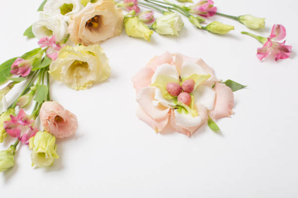 istock easter background with small eggs and pastel flowers on white 1367087966