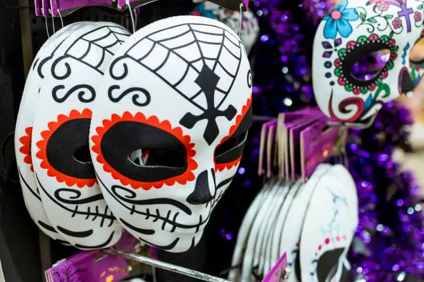 Photo of Dia de los Muertos, or in English, Day of the dead masks for Halloween for sale at a hypermarket or department store.