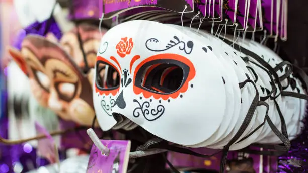 Photo of Dia de los Muertos, or in English, Day of the dead masks for Halloween for sale at a hypermarket or department store.